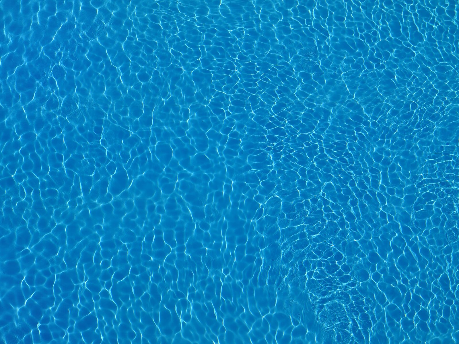 Clear rippling water surface of a swimming pool